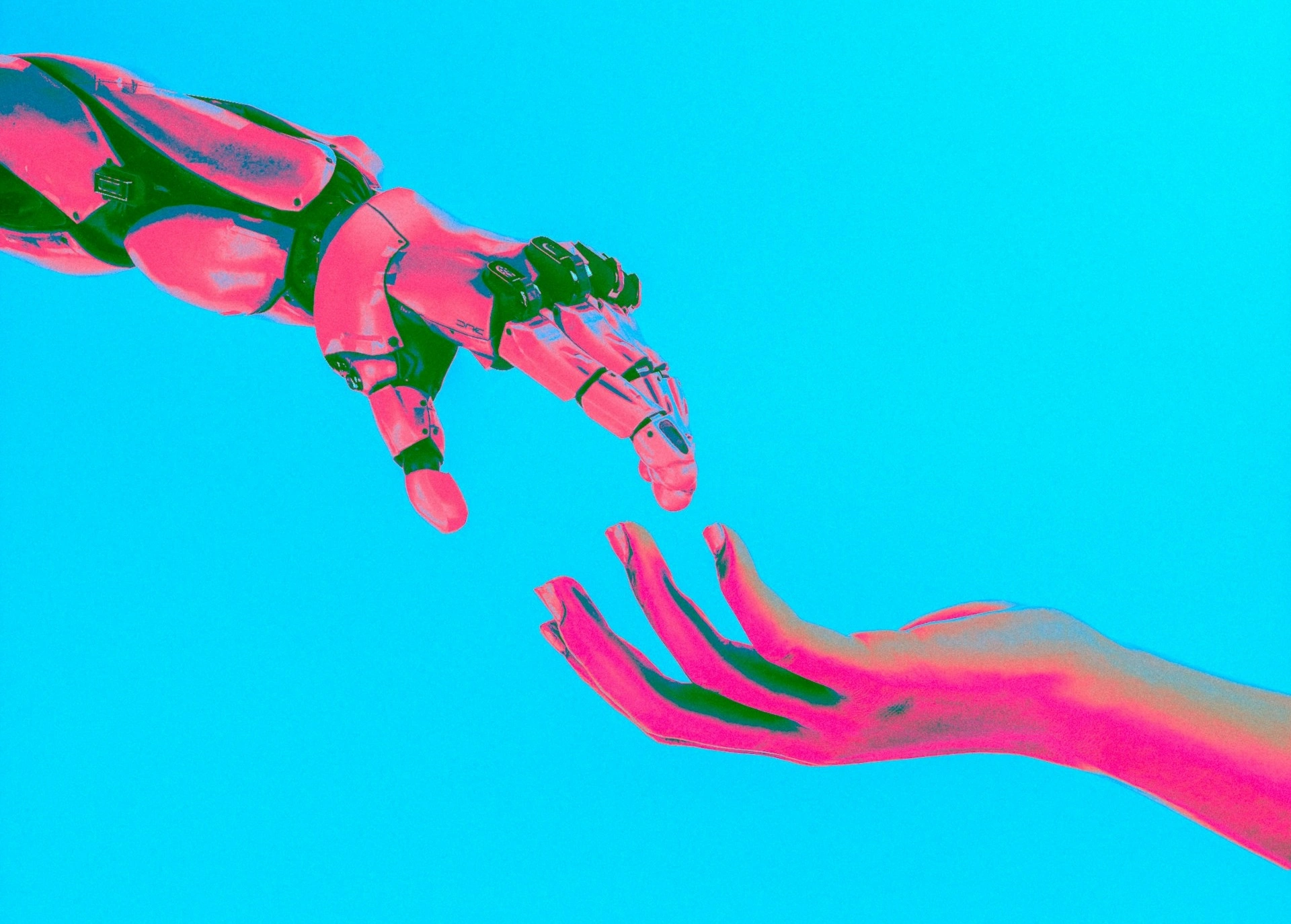 A person shaking hands with a robotic arm, representing AI and human collaboration.